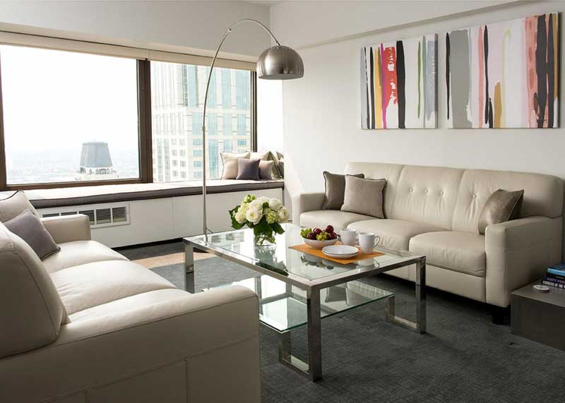 Modern White Living Room With Cream Leather Sofas