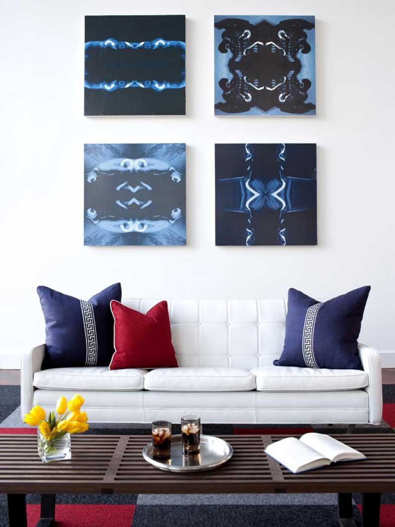 White Living Room With Blue Wall Art