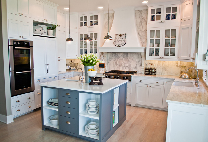 Small white kitchen with navy kitchen island with white laminate countertops 