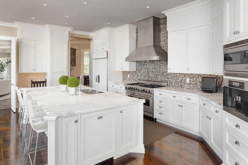 White kitchen with marble countertops