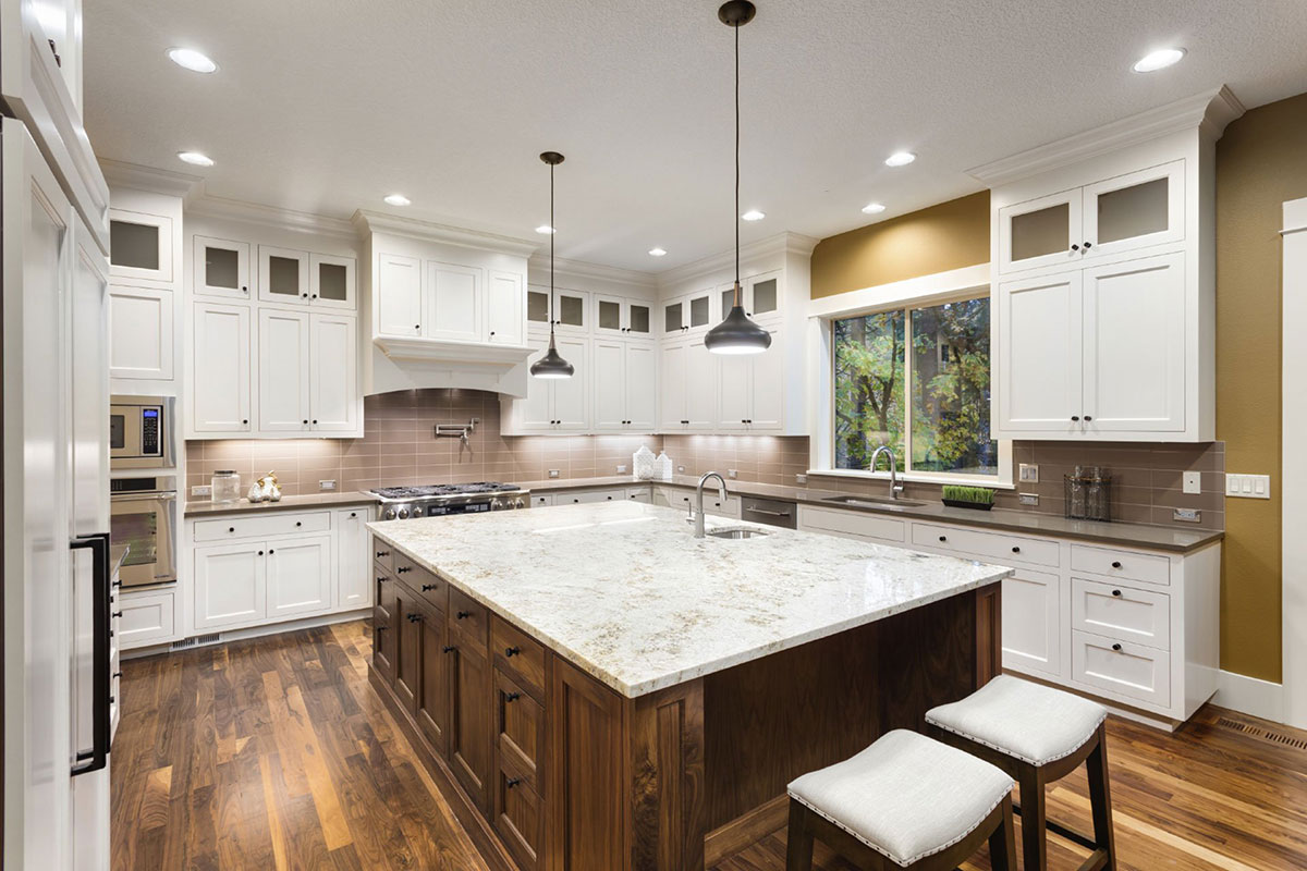 White kitchen with pendant lighting