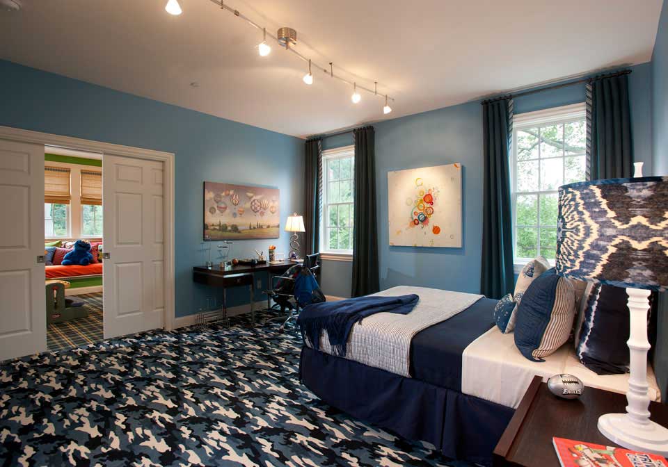 blue bedroom with track lighting