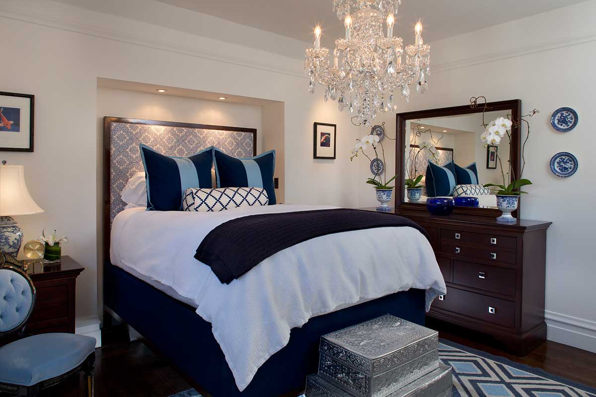 small bedroom with candle chandelier