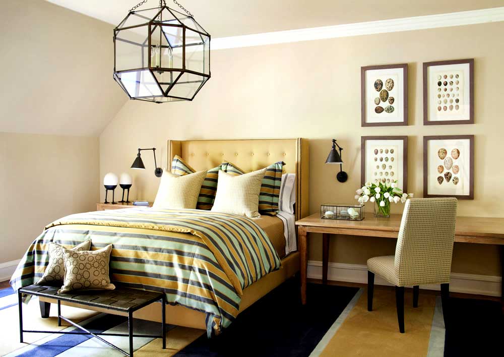 tan bedroom with cage lantern chandeliers 