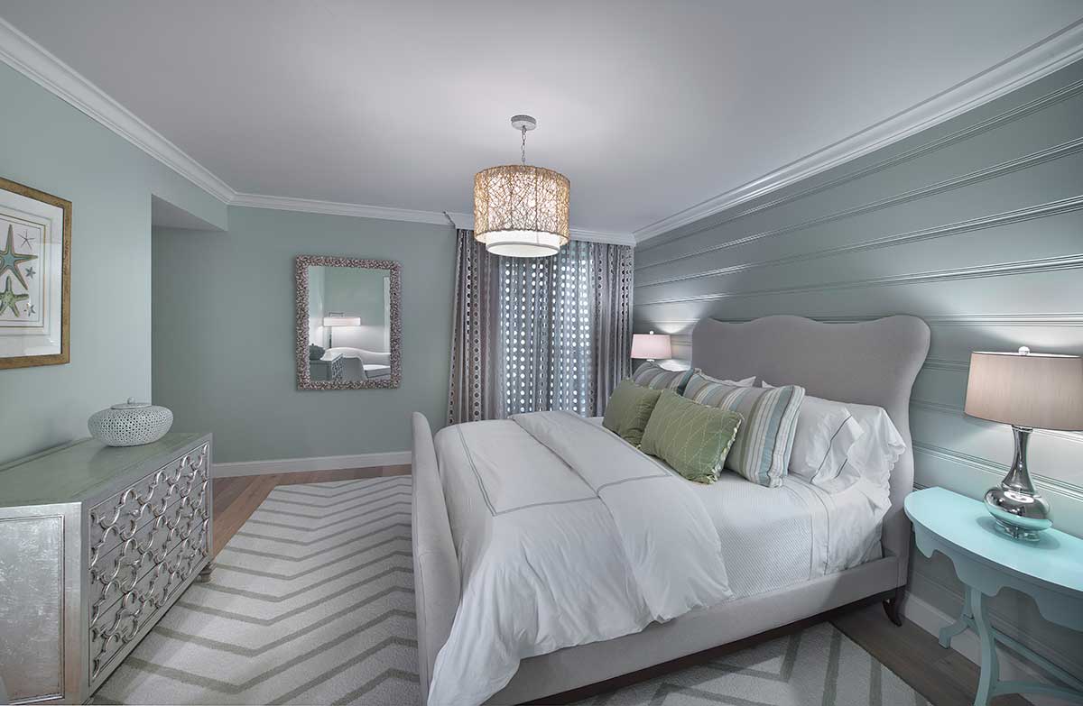 small grey bedroom with drum shade pendant lighting 