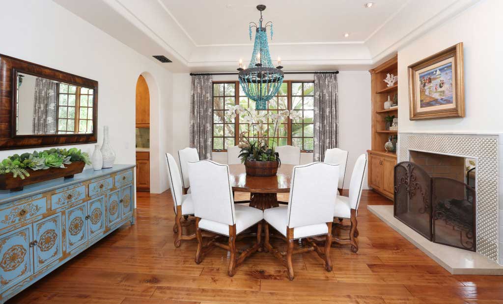 dining room with blue beaded chandelier light