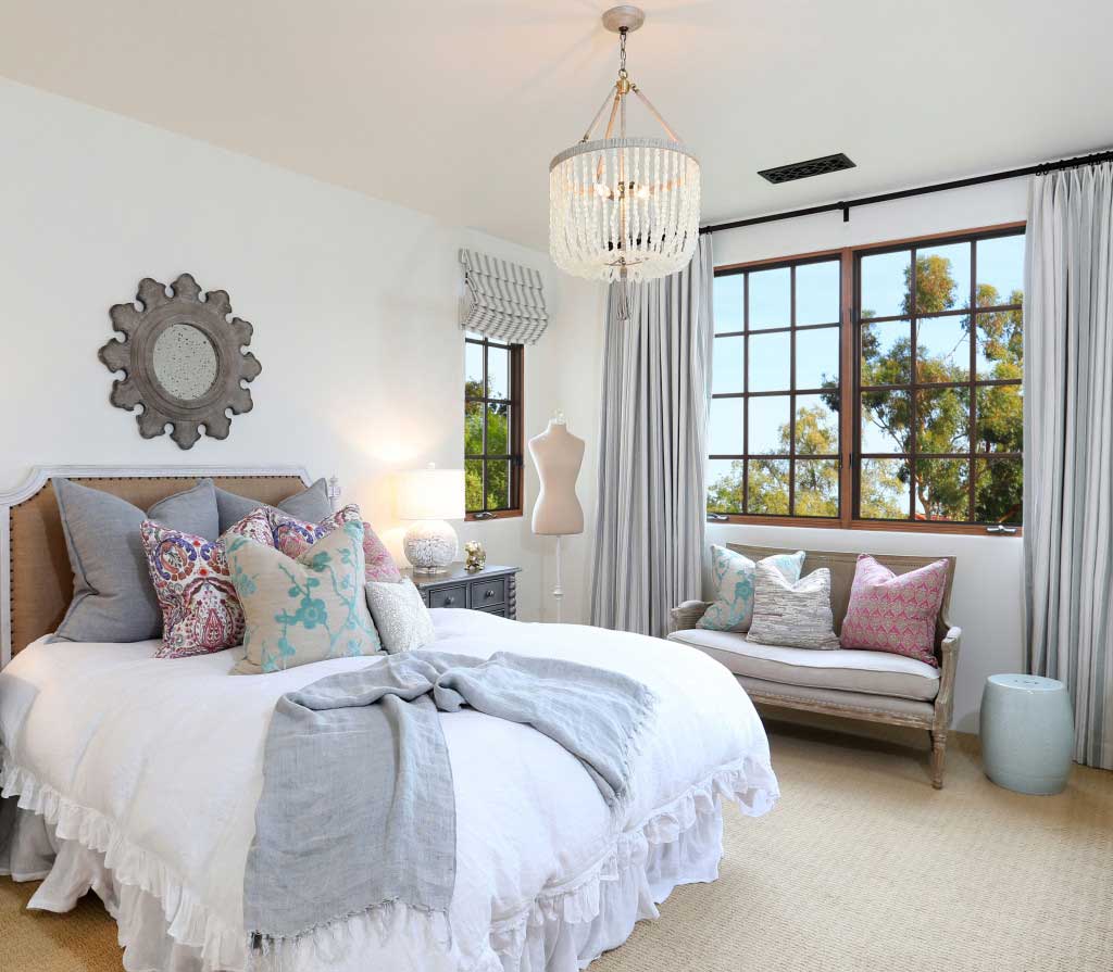 bedroom with white beaded chandelier 