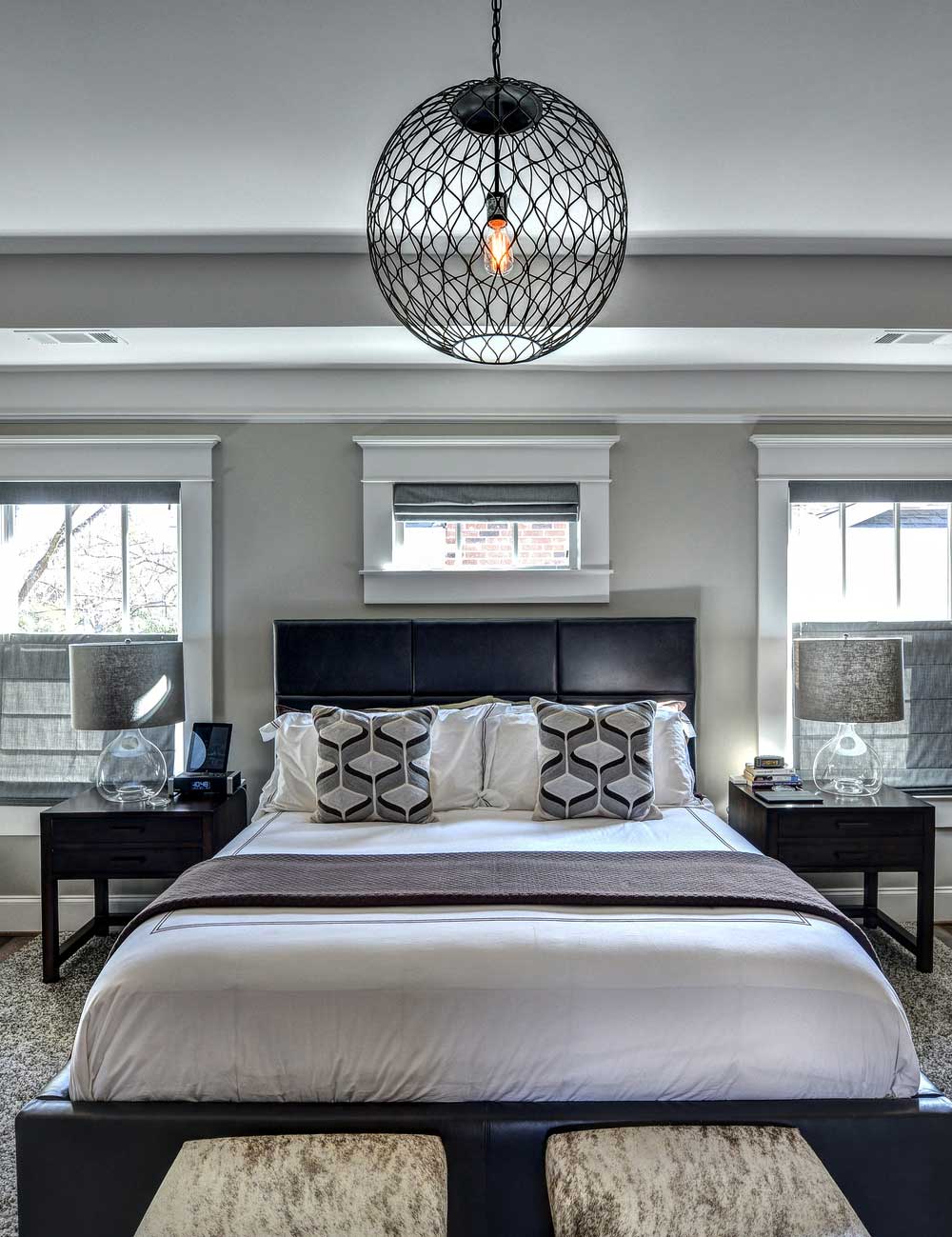small bedroom with orb pendant lights