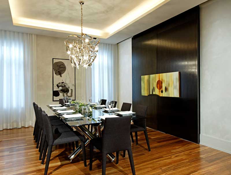 modern formal dining room with crystal chandelier