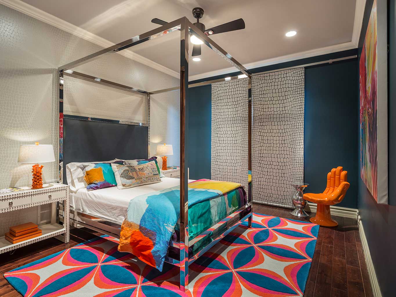 colorful bedroom with ceiling fan lighting 