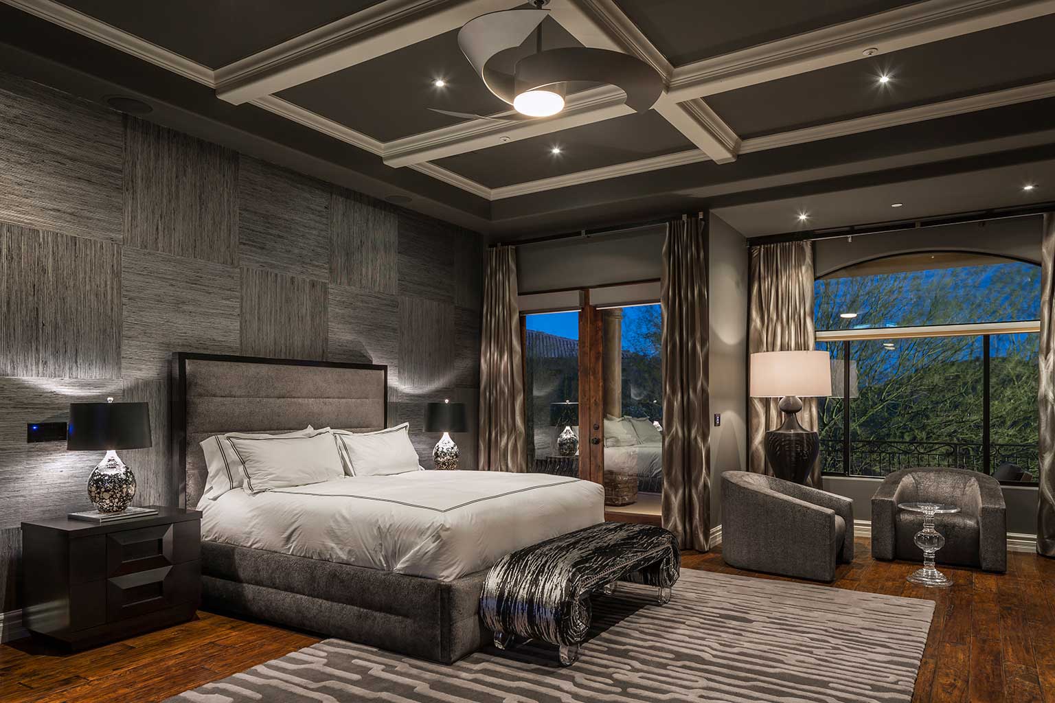 modern gray bedroom with table lamps