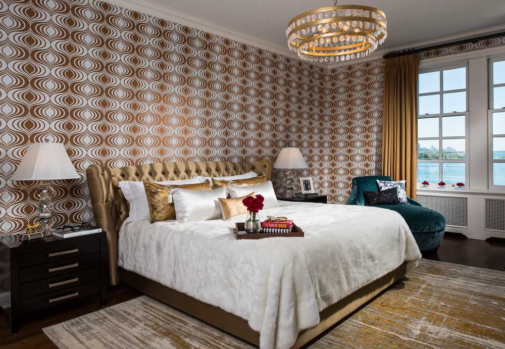 master bedroom with gold chandelier 