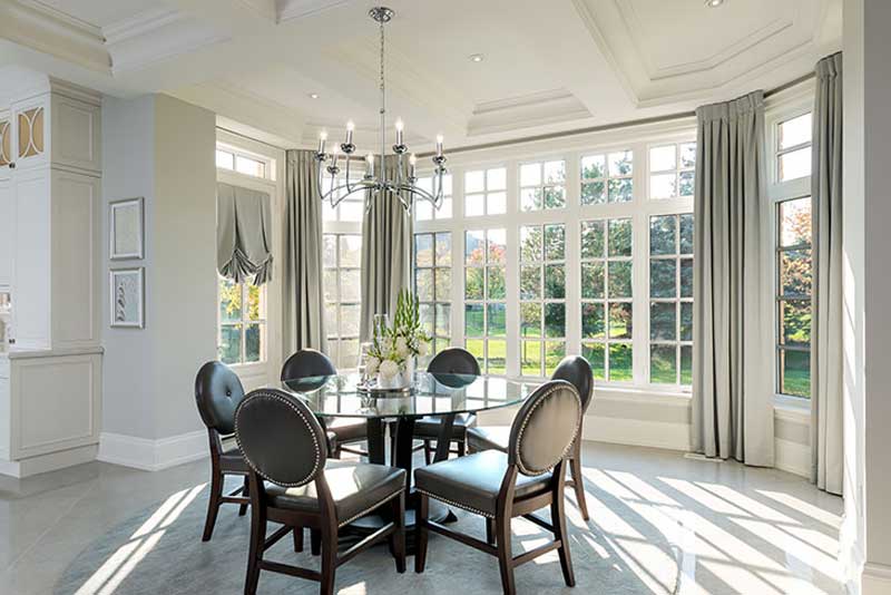 dining room with natural lighting and chandeliers