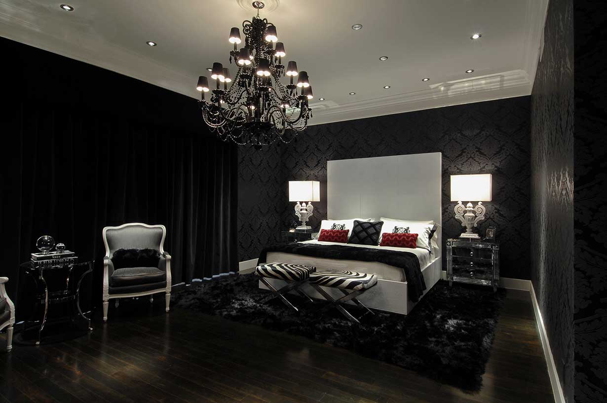 black bedroom with table lamps and black chandelier lighting