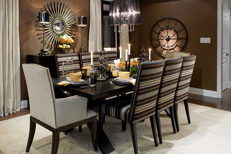 brown dining room with black drum chandelier and candle table lamps