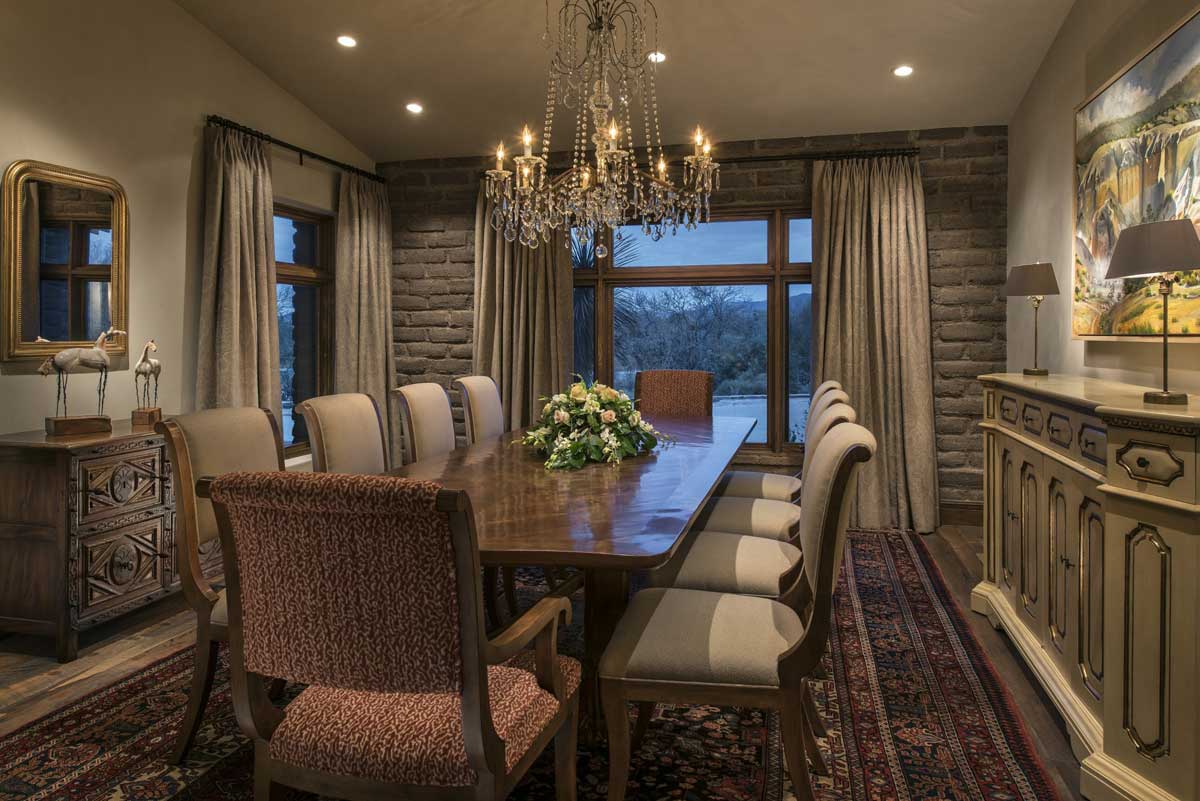rustic dining room with glass candle chandelier and table lamps