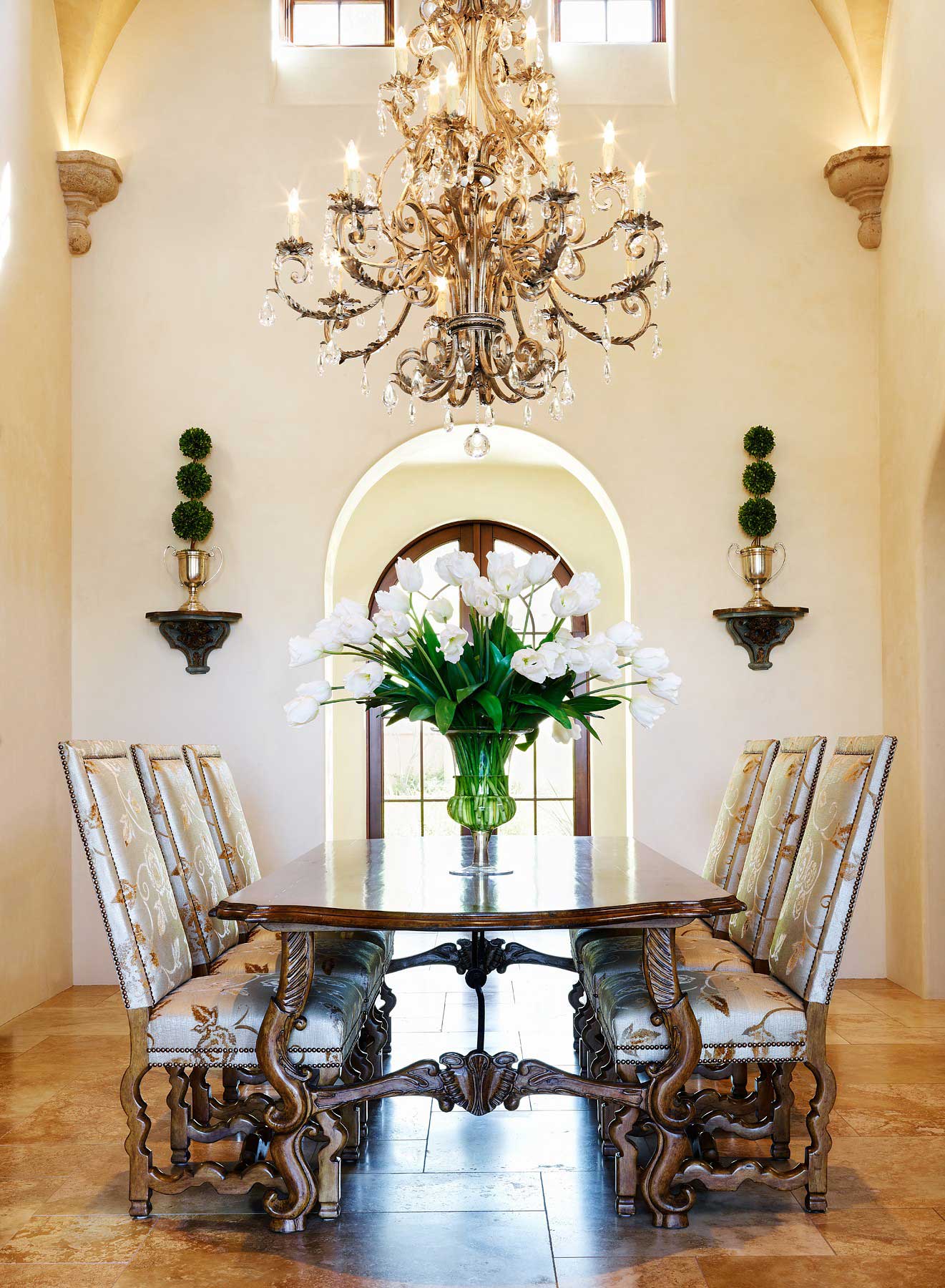 mediterranean dining room with candle chandelier