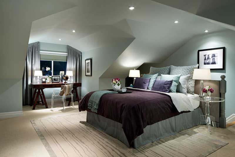 bedroom with table lamps and recessed ceiling lights