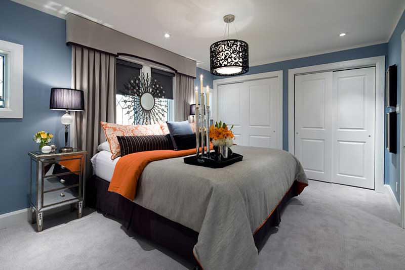 master bedroom with black table lamps and black drum chandelier 