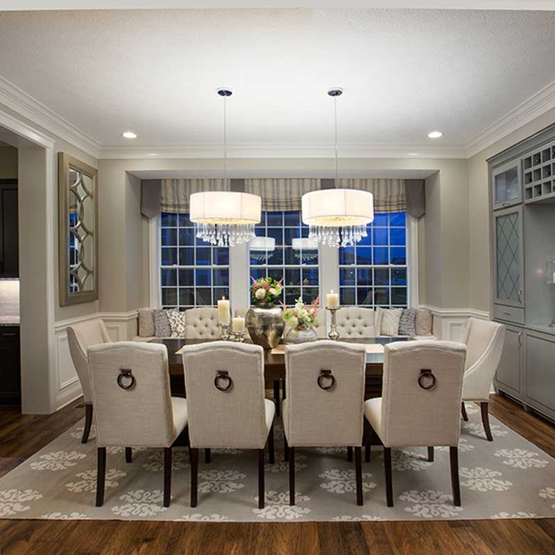 formal dining room with 2 chandeliers