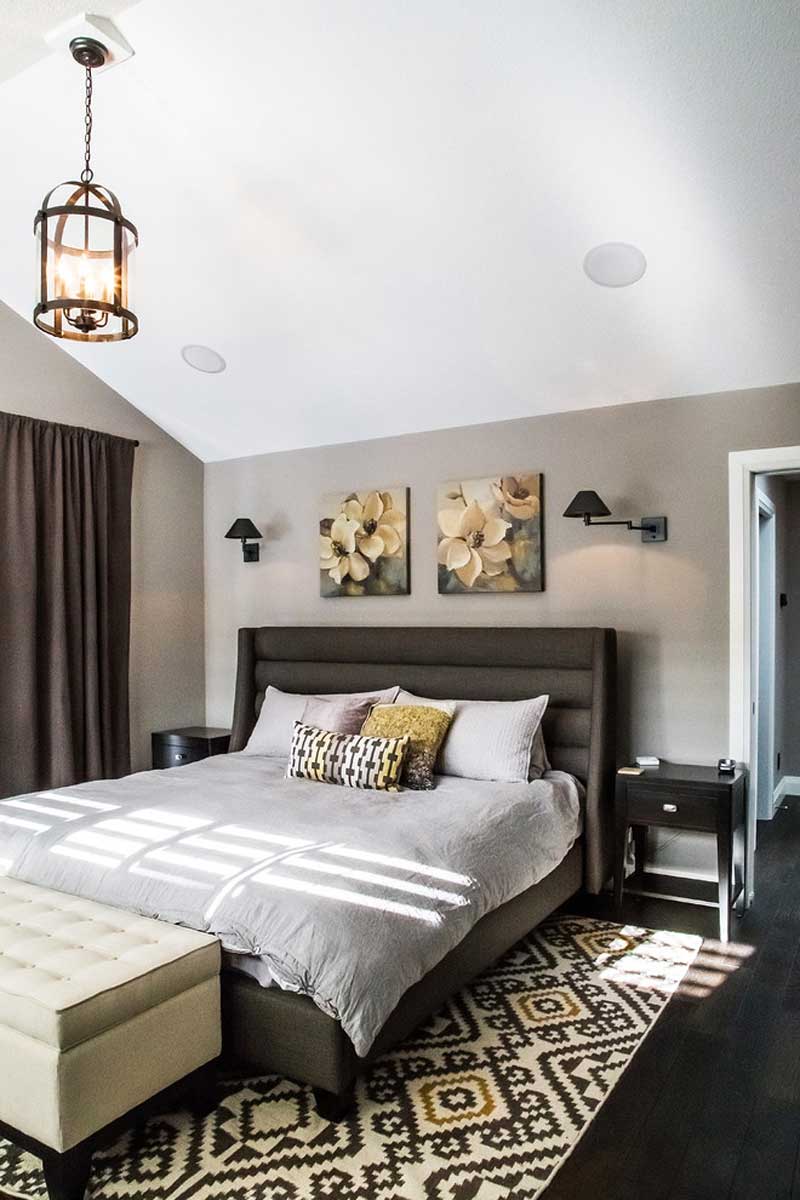 small bedroom with wall sconeces and lantern chandelier foyer 