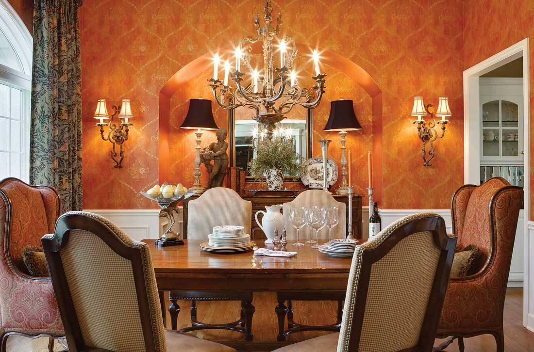 traditional dining room with table lamps, wall sconces and chandelier
