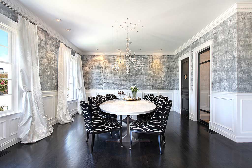 black and white dining room with glass candle chandelier