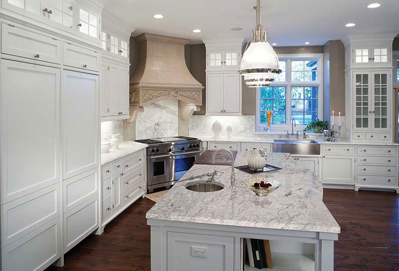 White kitchen with river white granite countertops