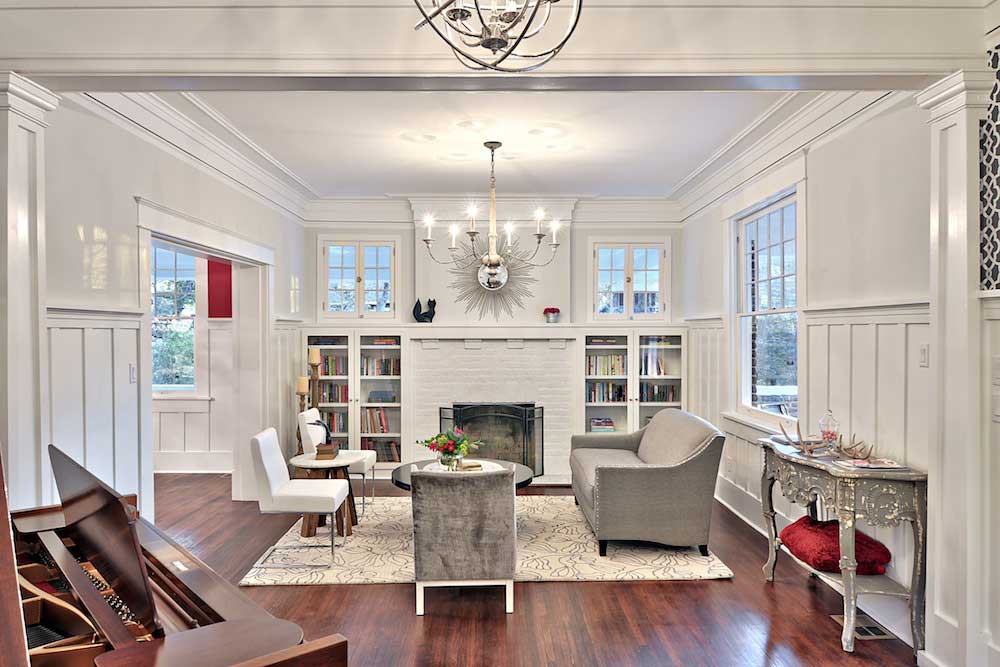 white living room with traditional candle chandeliers