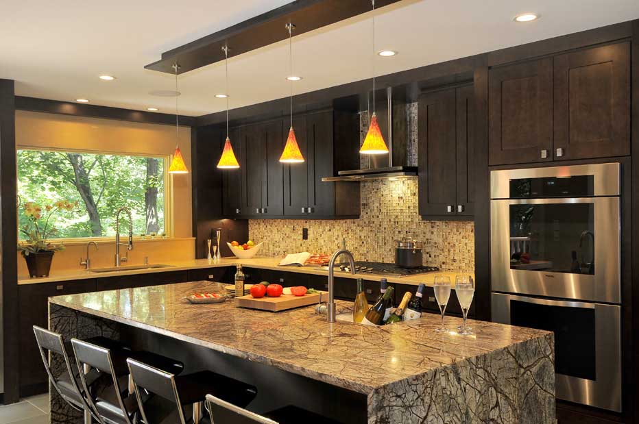 kitchen with orange glass pendant light