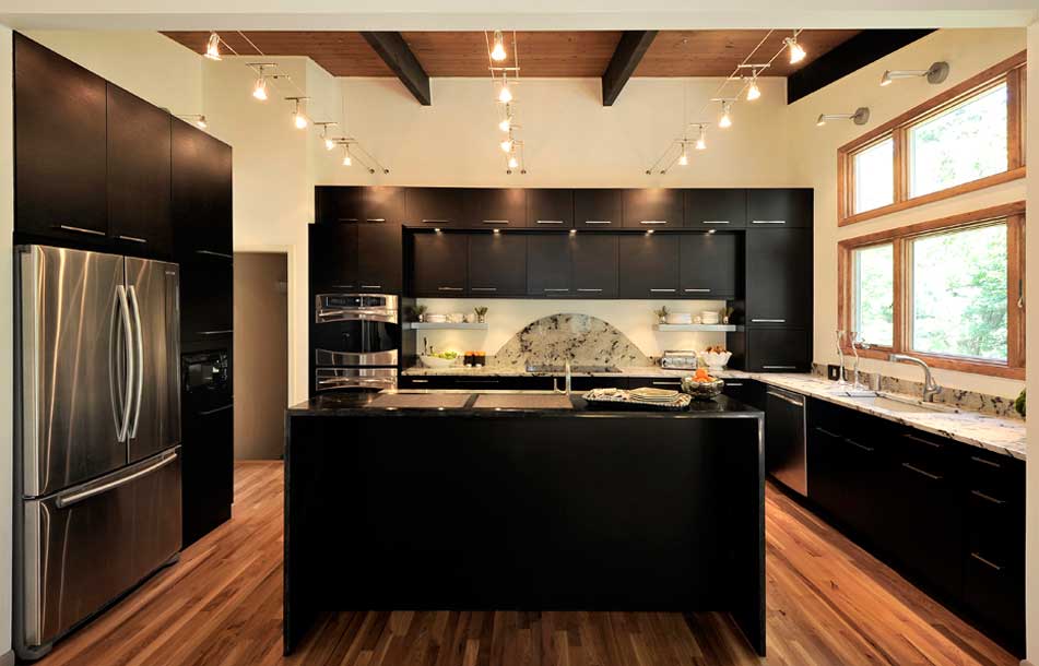 black kitchen with track lighting fixtures