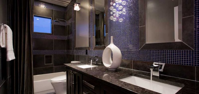 small bathroom with wall sconce chandelier
