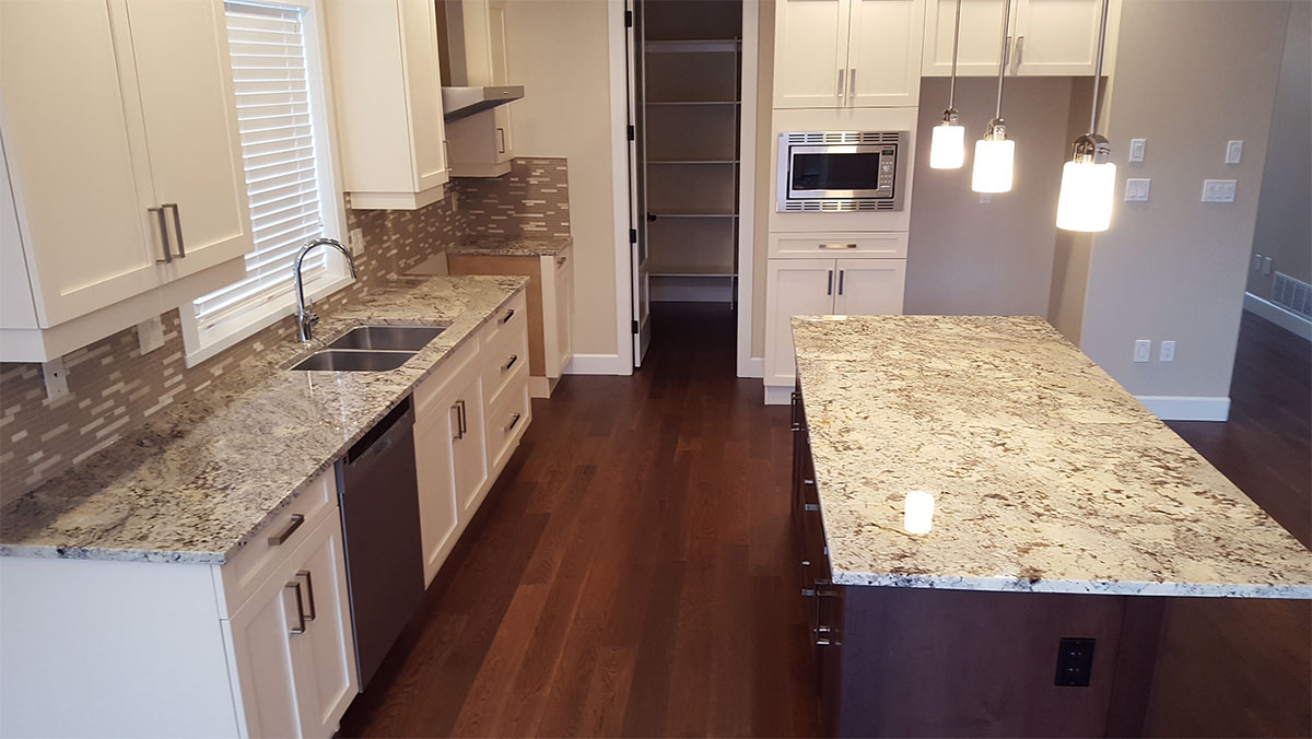 White kitchen cabinet with arctic white granite countertops