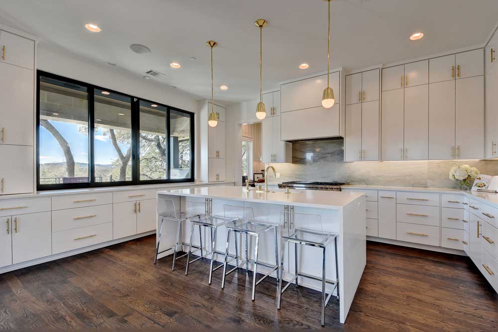 kitchen with modern gold pendant lights