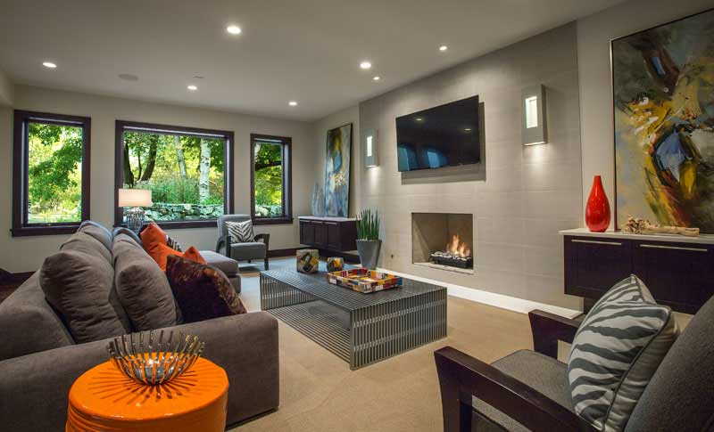 living room with wall sconces and recessed lighting fixtures