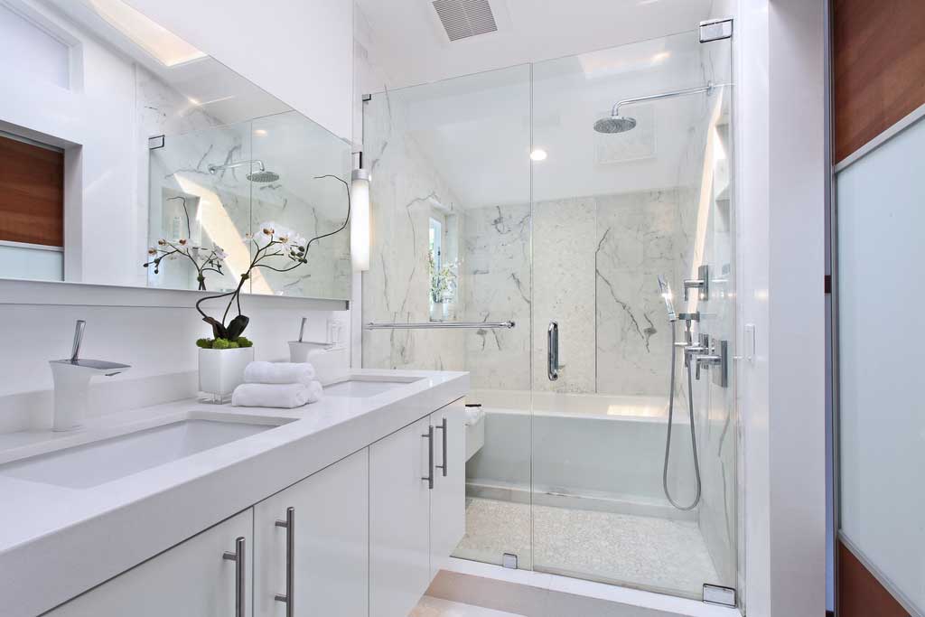 white bathroom with modern tube wall sconces