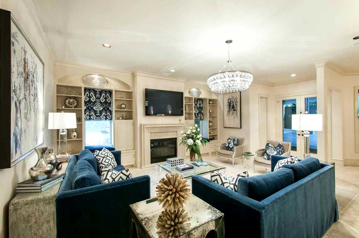 living room with square table lamps and round crystal chandeliers