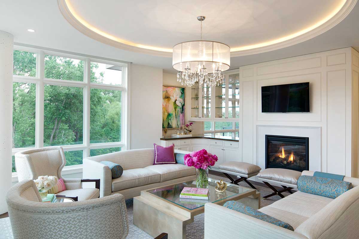 living room with drum shade chandeliers and led lighting
