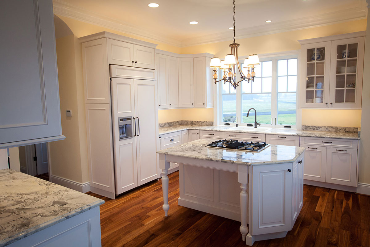 Traditional kitchen with supreme white granite countertops