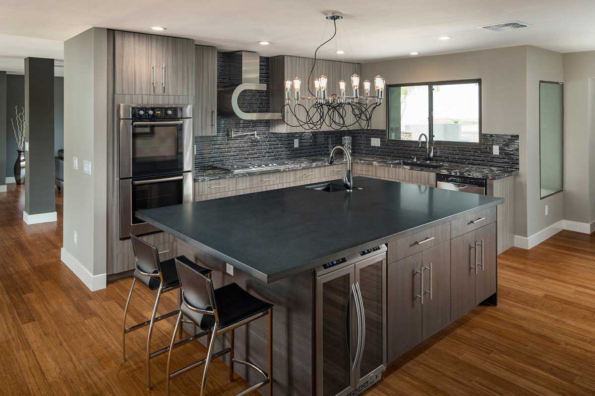 gray kitchen with light bulb chandelier