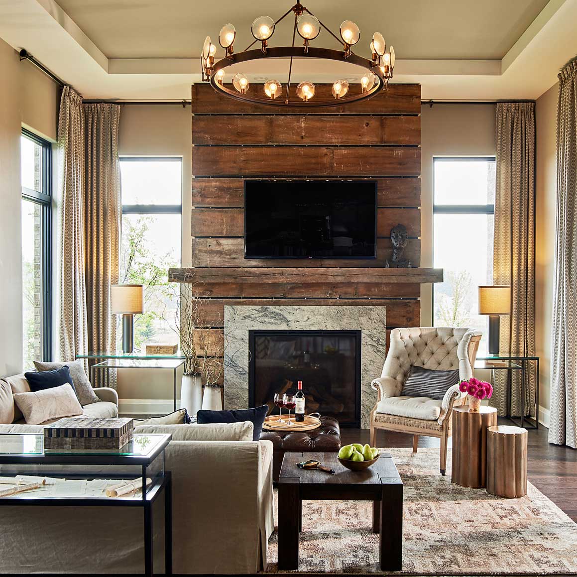 living room with round candle chandelier