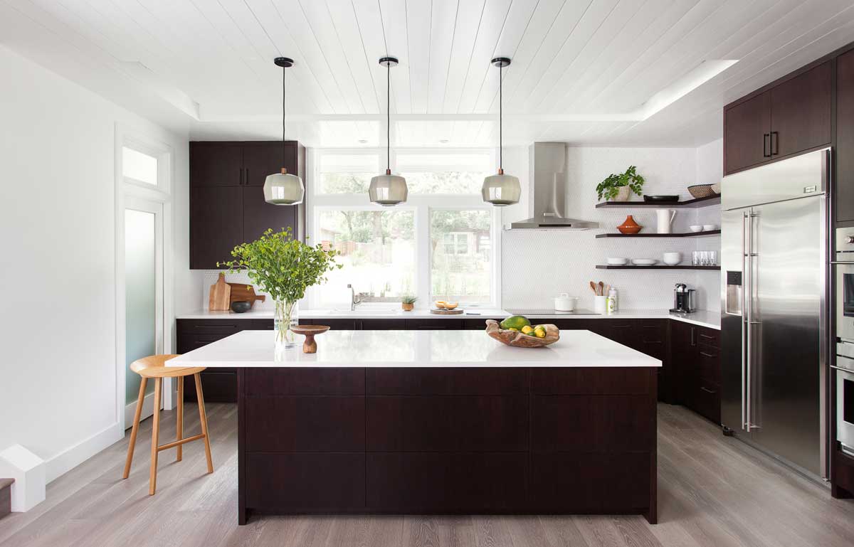 brown kitchen with polished nickel mini pendant light