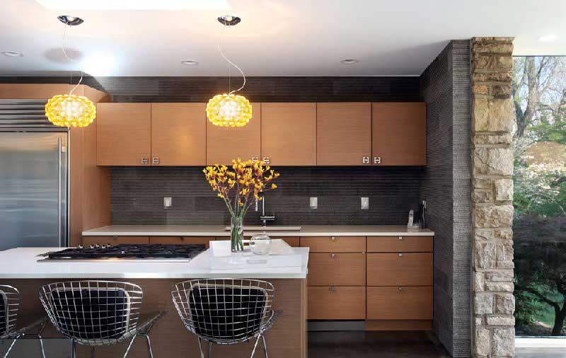 kitchen with yellow glass pendant lights