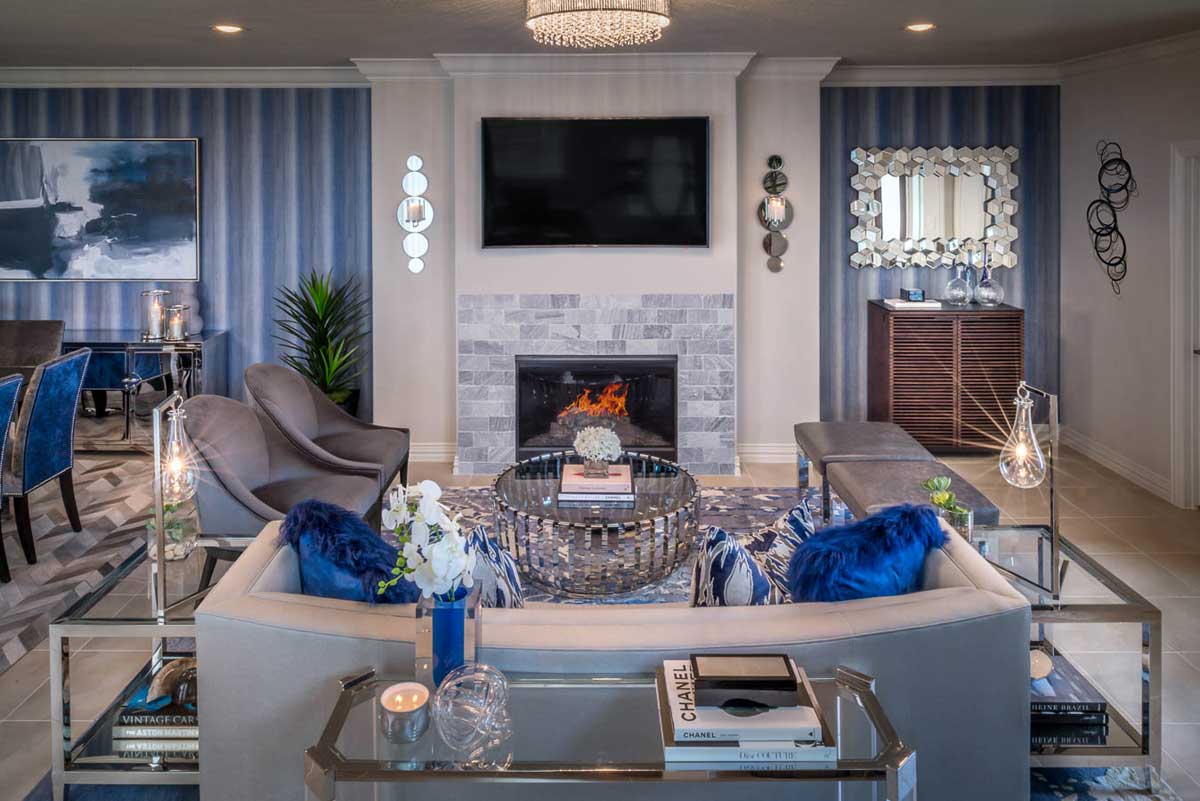 living room with clear glass floor lamps and chandelier