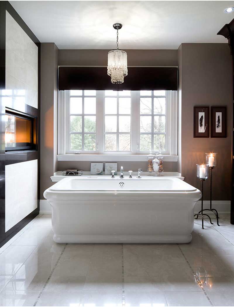 bathroom with chandelier and floor candle lamps