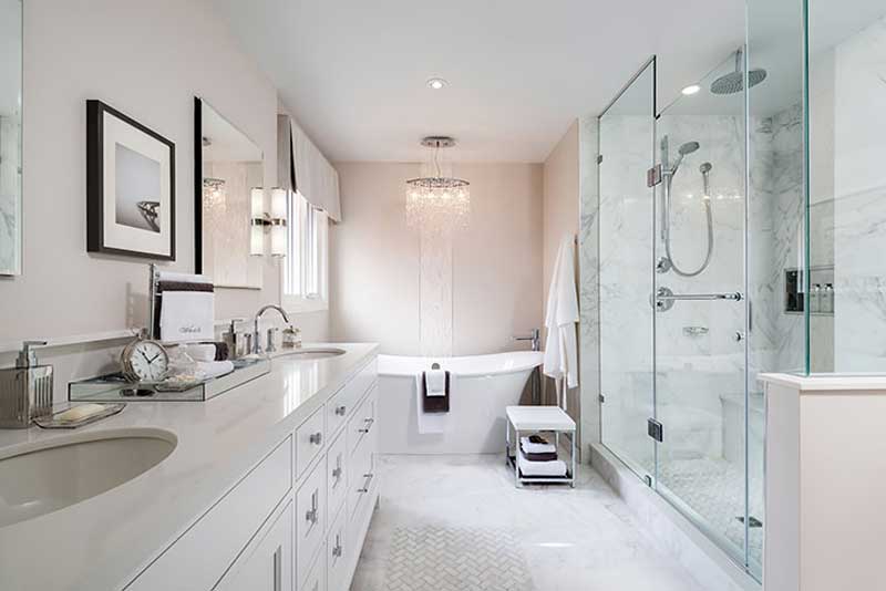 clean white bathroom with crystal chandelier