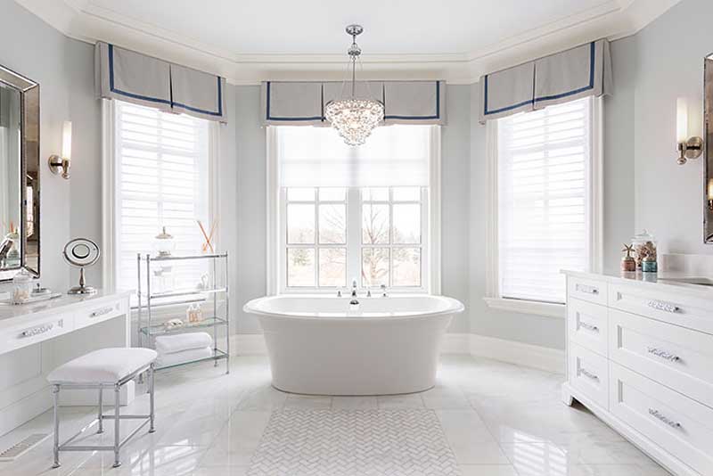 bathroom with natural lighting and crystal chandelier