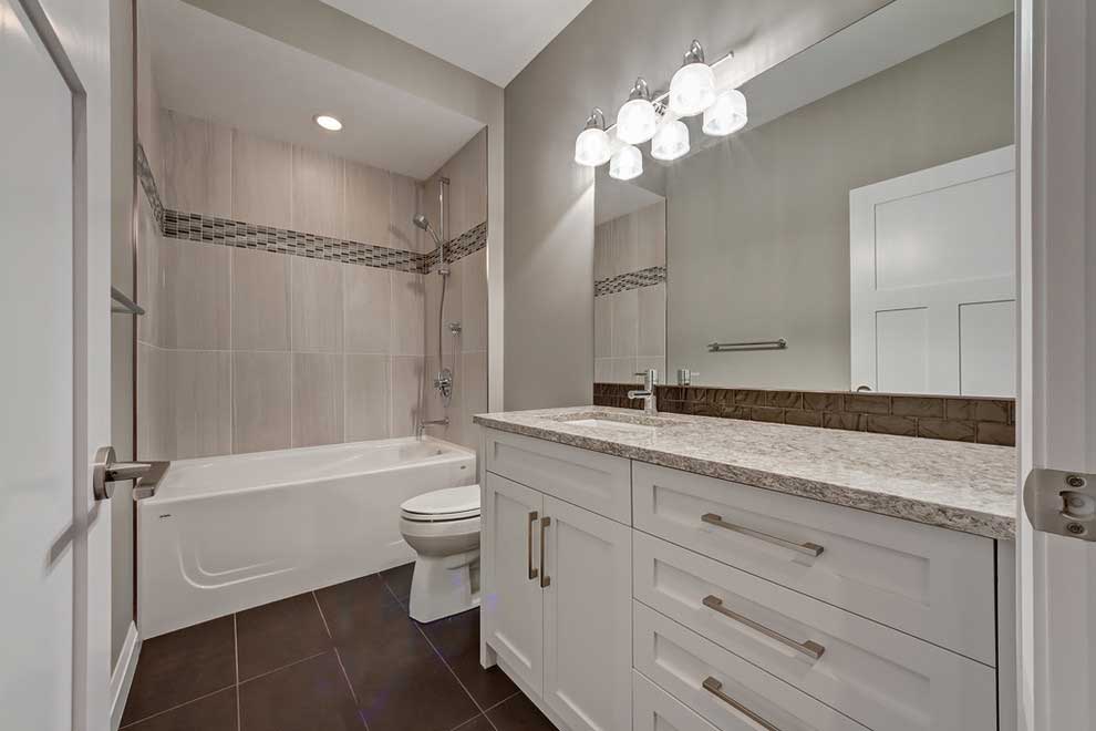 transitional small bathroom with wall sconces lighting