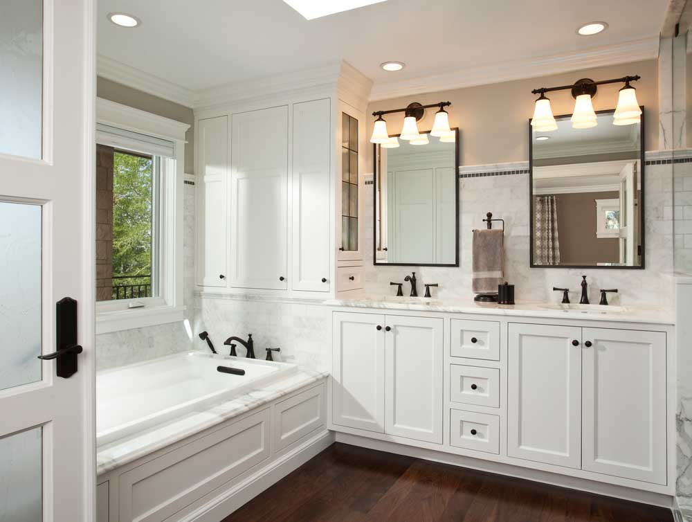 white small bathroom with wall sconces lights