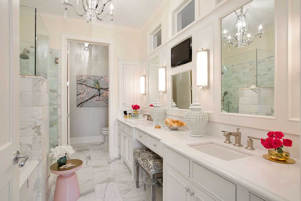 white master bathroom with crystal candle chandelier and wall sconces